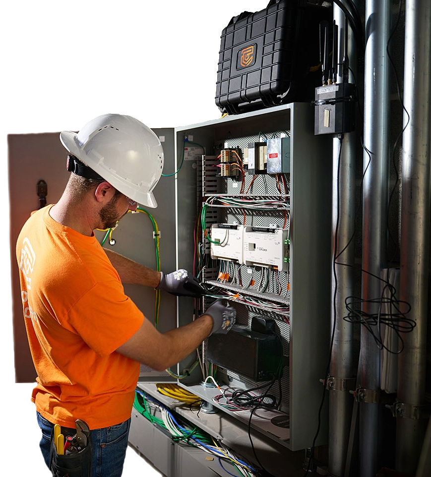 TC Controls technician working on a Johnson Controls Facility Explorer control panel